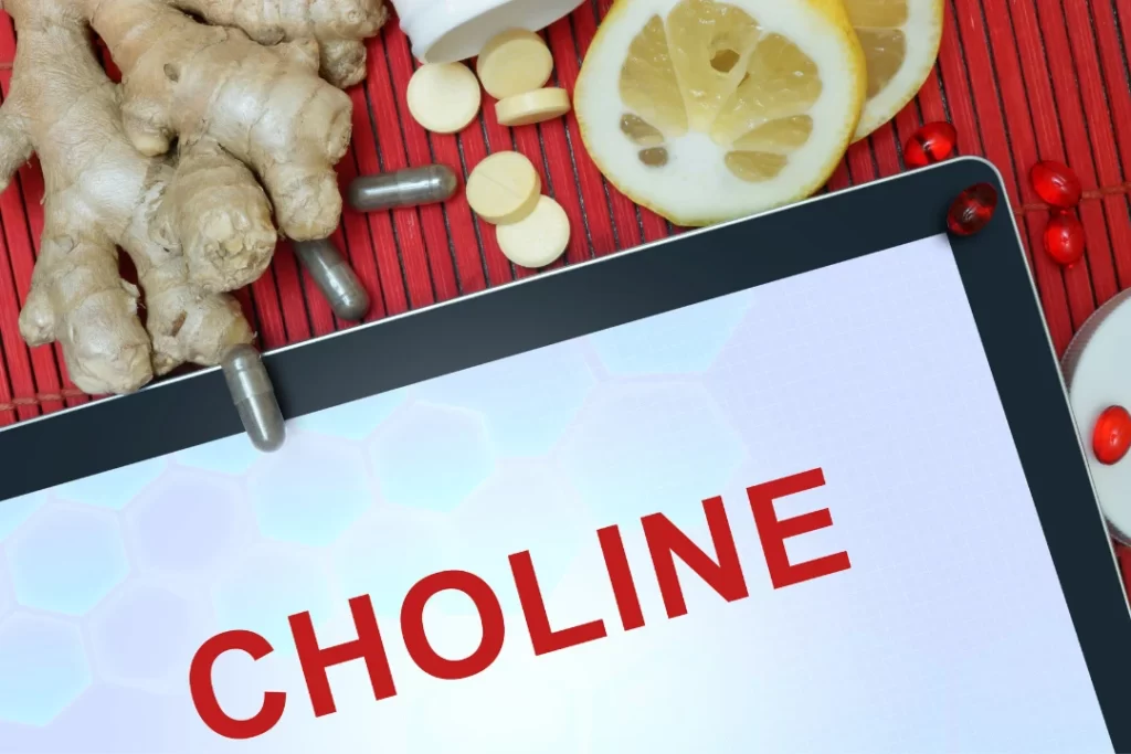 choline written on tablet with choline medicine pills lemon aside. 