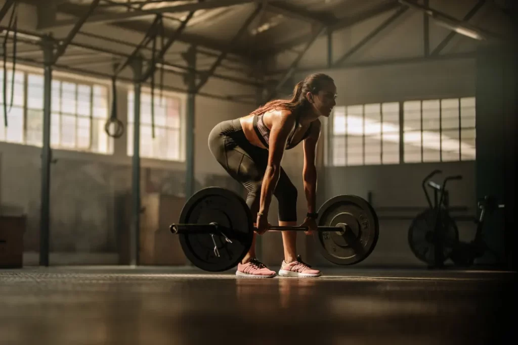 Fitness Model Performing Weight Lifting after intaking elevATP pills. 