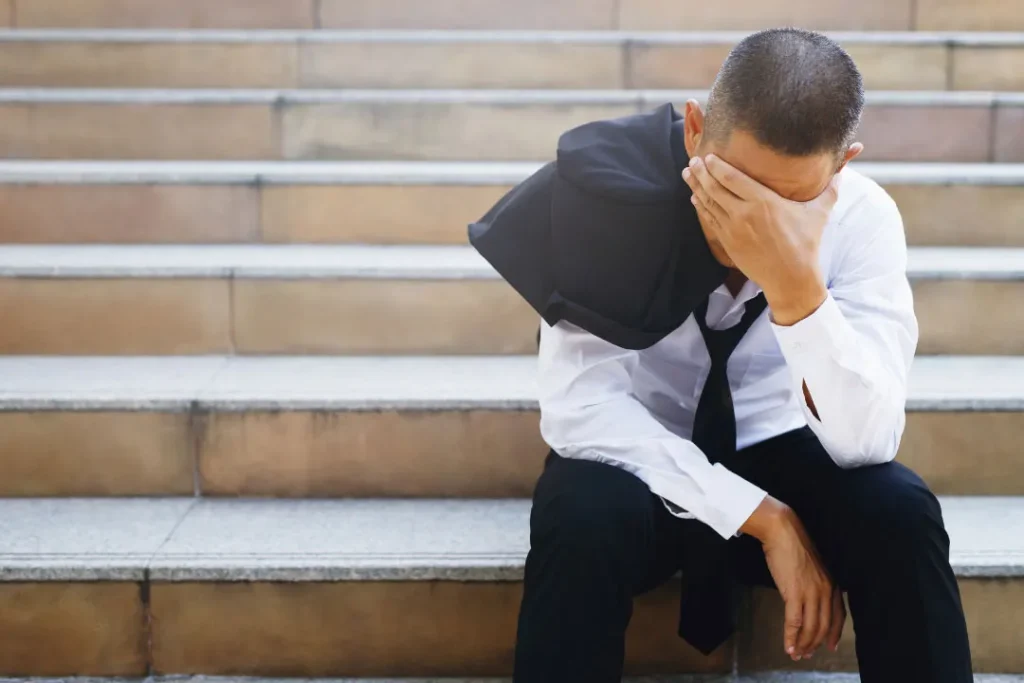 stress man sitting on stairs