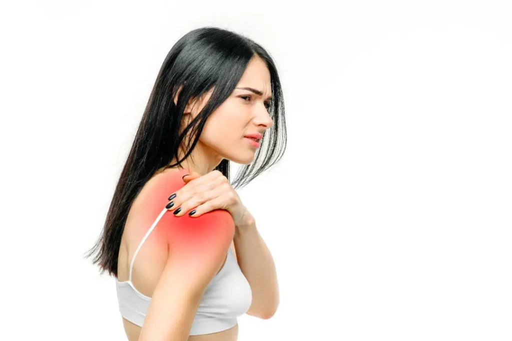 A young girl having pain in her shoulder. 