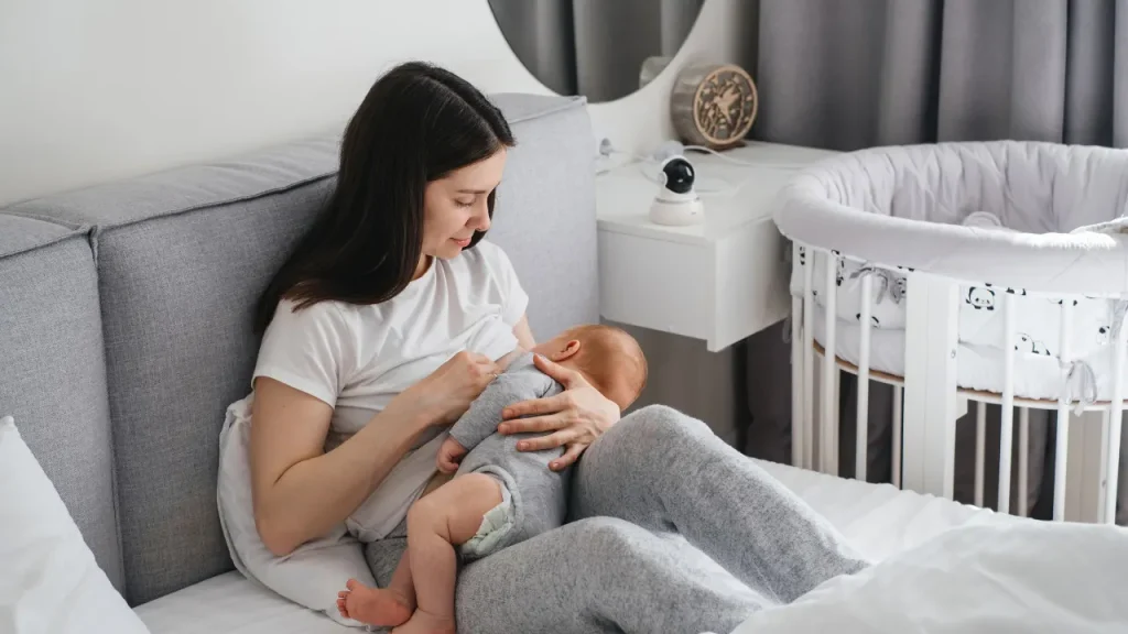 Mother feeding her new born baby.