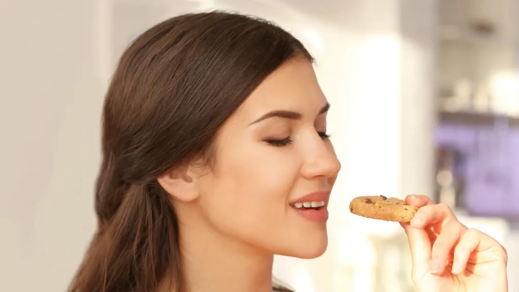 Girl eating amia cookie