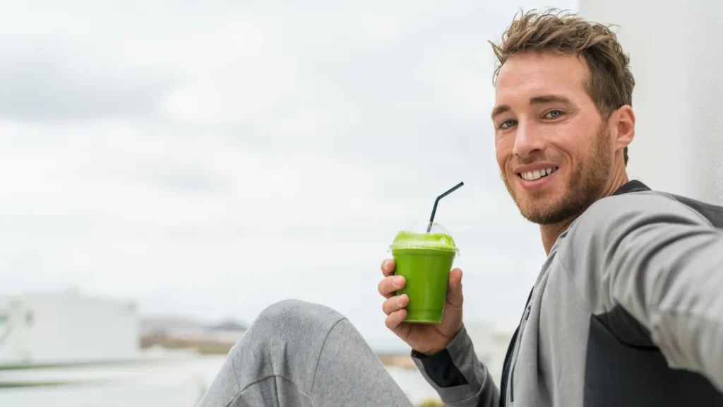 Man drinking Moringa juice 