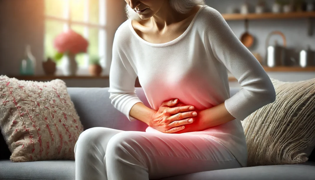 A realistic medical illustration of a mature woman sitting on a couch, holding her lower abdomen with a pained expression. A soft red glow highlights the area of discomfort, symbolizing post-menopausal cramps in a warm, home setting.